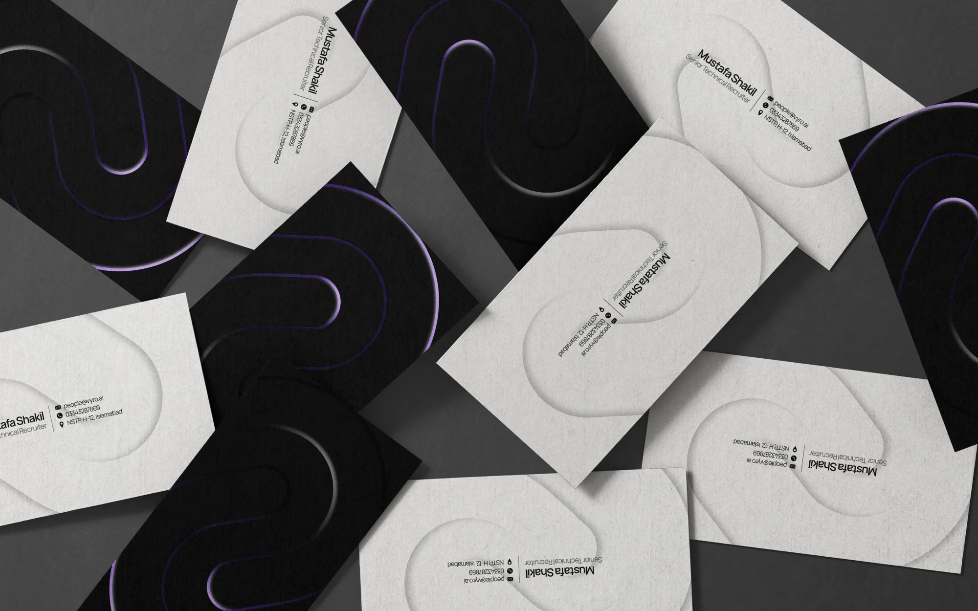 Vyro business cards — embossed motif in black and white