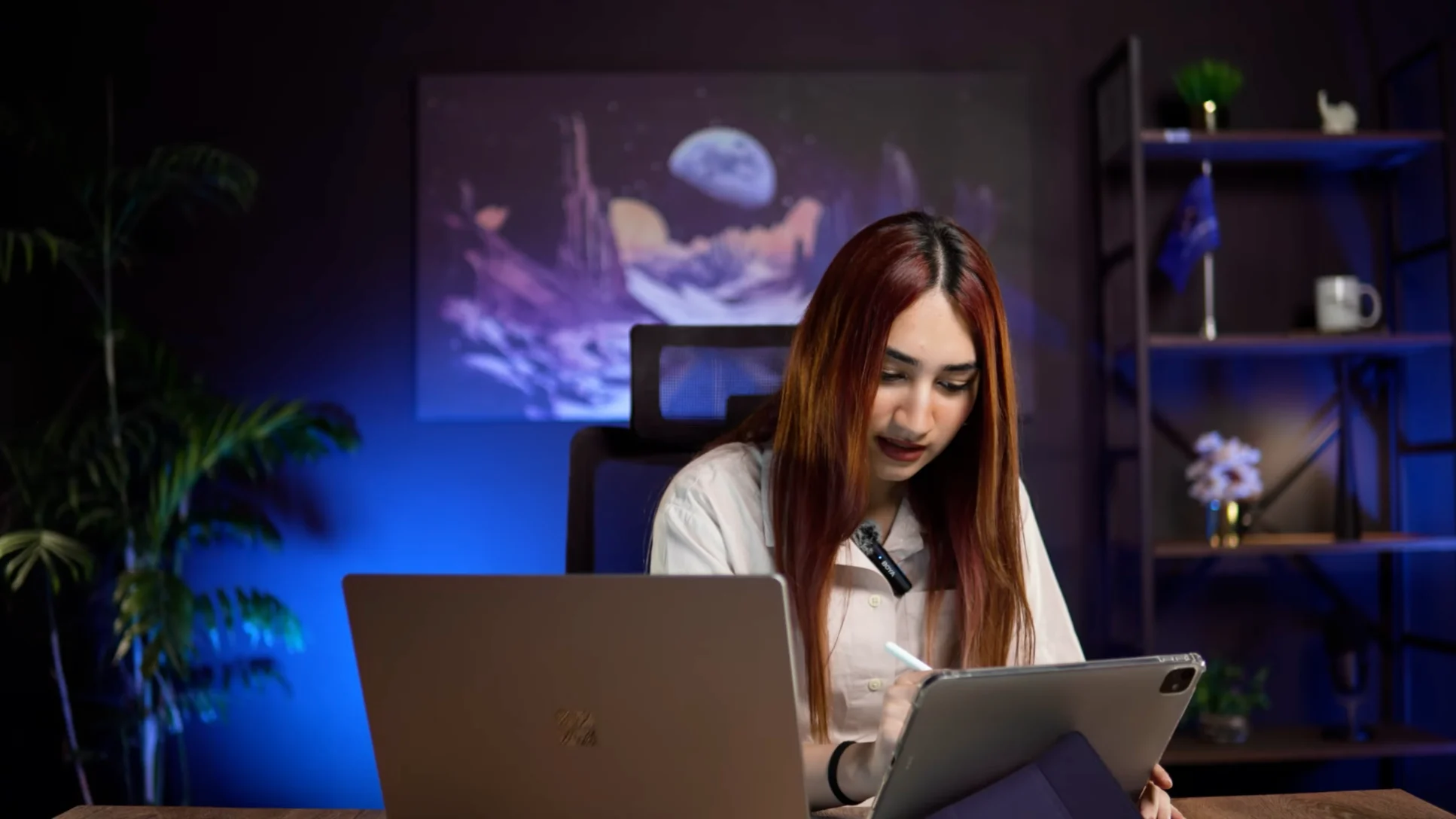 Presenter recording a tutorial at a desk with laptop and tablet